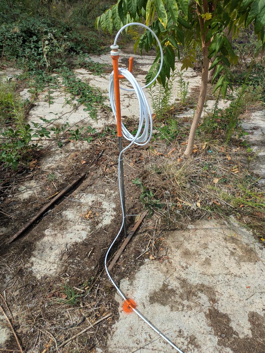 The Electro-Agriculture Antenna mast and the cable running across the slab to the earth spike