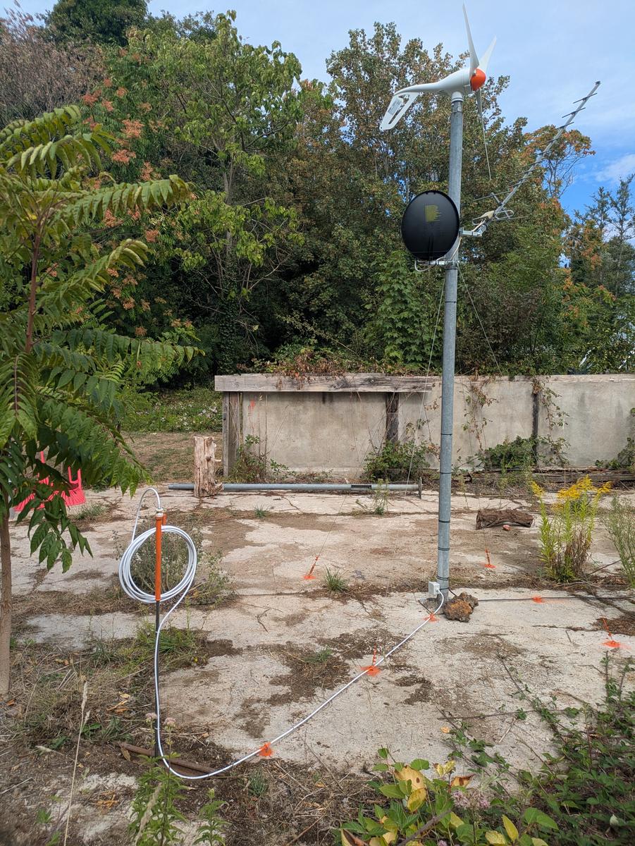 Earth spike with the surplus cable coiled at the head, alongside the disused railway track
