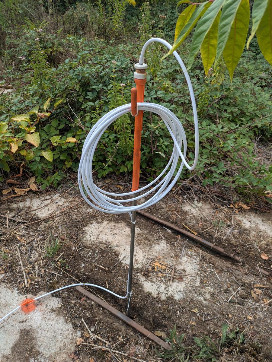 Detail of the insulator and the coiled cable at the head of the earth spike